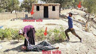 Tension between spouses: the husband protects the second wife from danger...