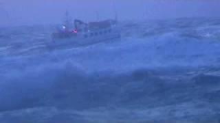 Asta B fishing boat coming in to harbour in heavy sea. Grindavik Iceland.