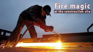 Slow motion. Fire magic at the construction site