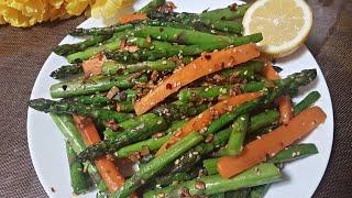 Stir fry butter garlic Asparagus with carrots.A side dish for dinner.