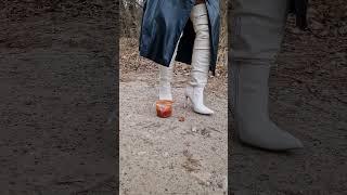 Thigh high high heel boots crushing tomato soup. Boot being sprayed by the soup. #boots #heels