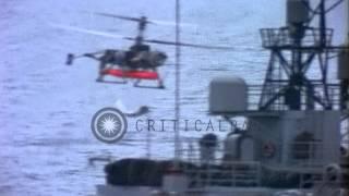 USN QH-50C DASH (Drone Anti Submarine Helicopter) with torpedo lifts off from des...HD Stock Footage