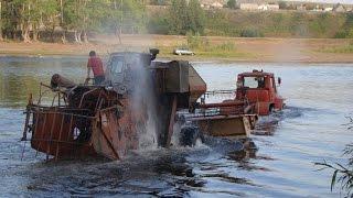 Tractor T-150K pulls Harvester SK-5 Niva through a deep river. Dangerous crossing!