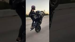 girl stunt a motorbike