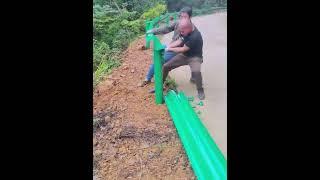 Highway curve safety guardrail construction