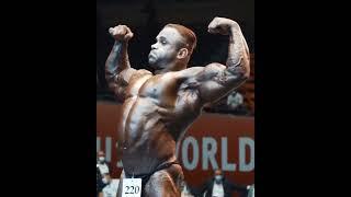 IFBB Pro Bodybuilder stage-flexing his rock hard muscles.