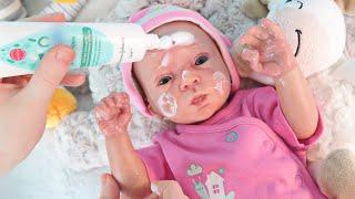 Reborn baby doll dress up and feedeng