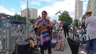 Native American flute in the bustle of the metropolis. Quena.