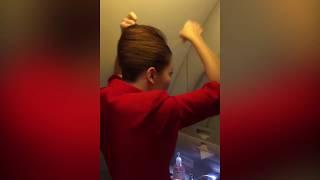 Air Hostess prepares her hair for TAKE OFF!  