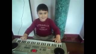 Playing mini piano and dancing. Kids fun playtime.  Henri playing piano.