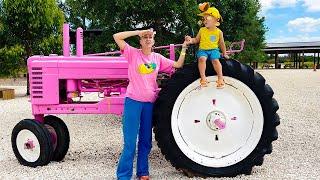 Chris and Mom learn how to harvest strawberries and vegetables at the farm