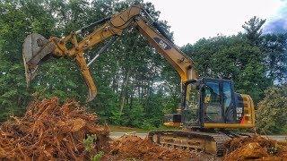 Caterpillar 312E Pulling Stumps