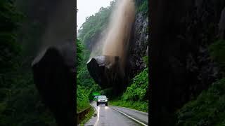 A huge rock hit the back of the green truck#shorts  #cliff   #car  #truck
