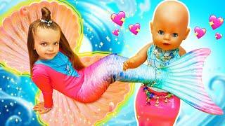 Baby Annabell doll and Maya pretend to play mermaids at the water park. Family fun stories for kids.