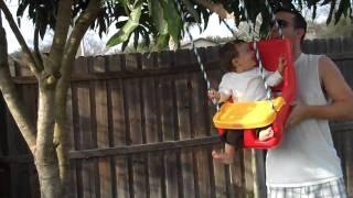 Ethan in his swinger with daddy  9months