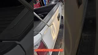 Dent repair on a tailgate.