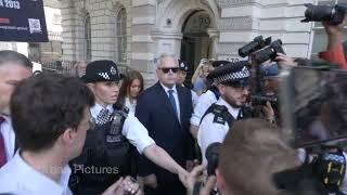 Huw Edwards runs chaotic media gauntlet to court with police escort