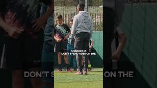 Coach Marvin Rowe going through some key details regarding the drill commonly known as scissors!