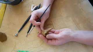 Bird skull pendant in clay