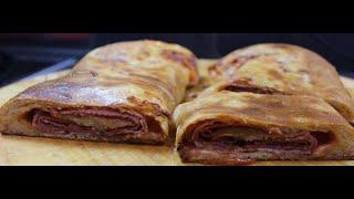 Italian rolled pizza STROMBOLI. 