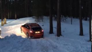 Subaru XV climbing a snow hill