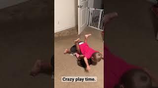 Toddler tries to plank on sister. #toddlerlife #siblings #shorts