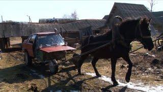 In the Belarusian countryside, a farmer rides a ‘horse-mobile’