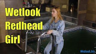 Wetlook Redhead girl in denim clothes swims in the pool dressed | Wetlook jeans