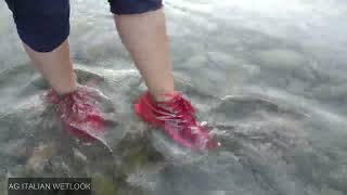 Wetlook - Iris in the river with red sneakers - 4K