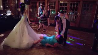 Drunk wedding guest goes down on the dancefloor and almost takes out the bride!