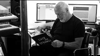 David Gilmour with the book of photos by Polly Samson from the Luck and Strange deluxe box set