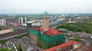 Fly around tall tower of Rathaus Spandau. Historic building of town hall of Spandau borough. City