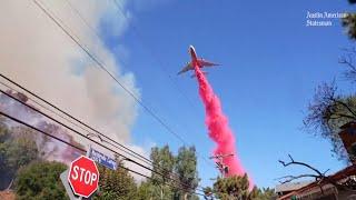 See firefighters battle California fires as aircrafts drop water, flame retardant over Los Angeles