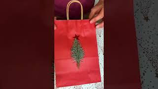 Turn a pine tree into a gift bag!  #hacks #gifting #holidays