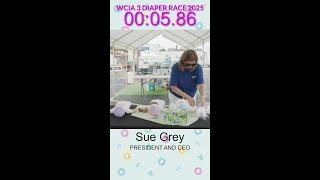 Sue Grey competes in diaper race
