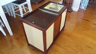 Columbia C1459, console STEREO record player playing a LP record