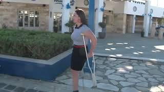 Amputee Woman Walking With Underarm Crutches