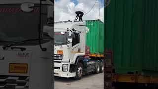 Container truck enters gas station at dry port