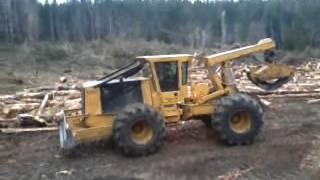 tigercat 620c  bladeing off skid