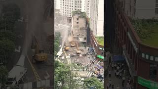 The process of dismantling a building in the city center