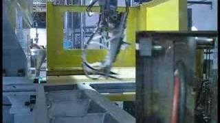 Yushin robot on injection molding press