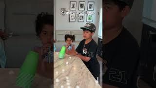 Kids Compete in a Fun Cotton Ball Cup Challenge Indoors