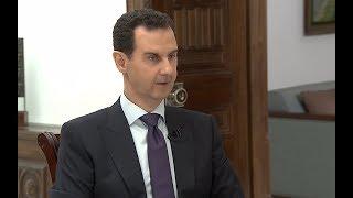 Bashar al-Assad warns US troops to leave Syria as he raises prospect of clash