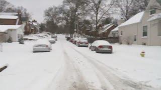 People dig out of snow-covered neighborhoods in St. Louis County