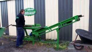 Beaver equipment electric firewood saw bench with an out feed conveyor