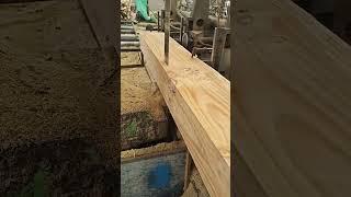 Wood is processed at a wooden architectural factory