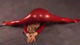 Flexible Contortionist Sits On Her Own Face