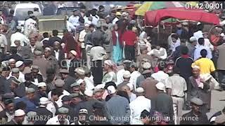 Ethnic Uighurs in crowded street market in Kashgar in western China. Summer 2001 | Tape 250 P14