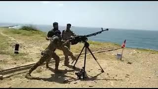 12.7 mm anti aircraft gun firing by marines