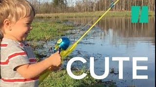 Little Boy Catches Fish with Toy Rod